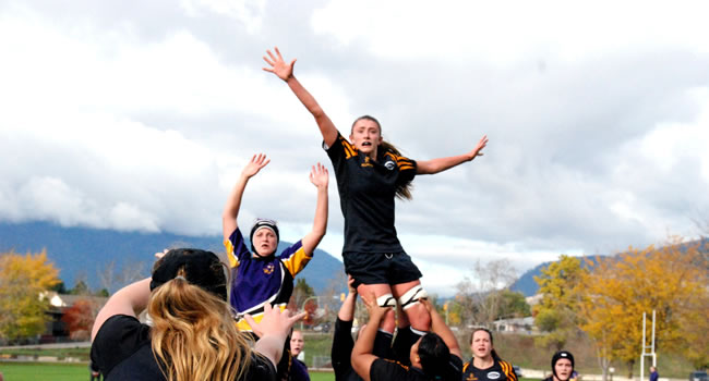 Rugby match in progress highlighting movement, contact and game intensity