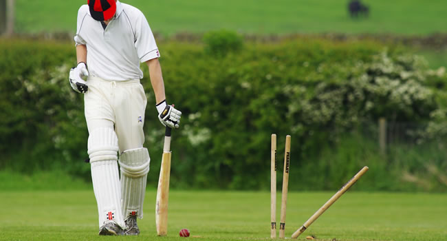 Cricket player dismissed showing outcome of play and physical demands of the game